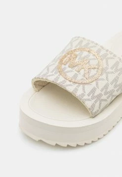 MICHAEL Michael Kors ELI STACKED MONOGRAM - Mules - Vanilla -MICHAEL Michael Kors shop 11cc34e583ff489c925e52483b050b27