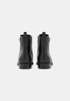 MICHAEL Michael Kors PADMA STRAP FLAT BOOTIE - Classic Ankle Boots - Black -MICHAEL Michael Kors shop 3c2048a0591e407da35986dd072eef6c