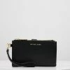 MICHAEL Michael Kors JET WRISTLET - Wallet - Black -MICHAEL Michael Kors shop 5f90f63b5300440b9d04165042d3887a