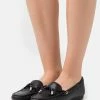 MICHAEL Michael Kors SUTTON - Moccasins - Black 1 MICHAEL Michael Kors SUTTON - Moccasins - Black -MICHAEL Michael Kors shop 6777b13269bd44408477b66af3f6499f