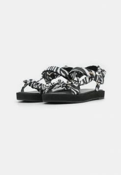 MICHAEL Michael Kors PHOEBE - Sandals - Black/white -MICHAEL Michael Kors shop 6cf4022ee15a462f92dee96f33119993