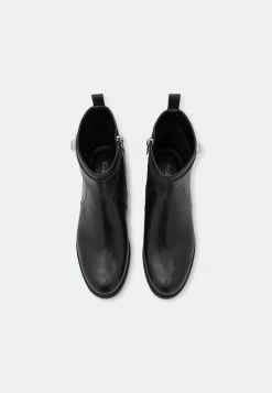 MICHAEL Michael Kors PADMA STRAP FLAT BOOTIE - Classic Ankle Boots - Black -MICHAEL Michael Kors shop 808671a3b28e4c4c8ccba9fa3f2d6738