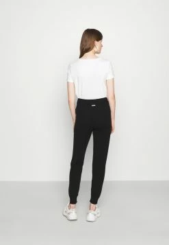 MICHAEL Michael Kors LOGO TAPE JOGGER - Tracksuit Bottoms - Black -MICHAEL Michael Kors shop 9c92f6dbe1df443292cc9598180f9fa0