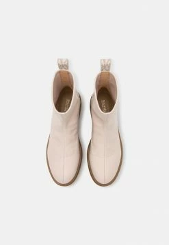 MICHAEL Michael Kors COMET LUG BOOTIE - Classic Ankle Boots - Light Cream -MICHAEL Michael Kors shop 9ccb45347ab34d37ac656ba62654f110