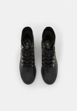 MICHAEL Michael Kors BREA - Lace-up Ankle Boots - Black/gold -MICHAEL Michael Kors shop ba5d6b4ebd30425da0aca4ad9532a206