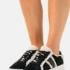 MICHAEL Michael Kors IRVING STRIPE LACE UP - Trainers - Black -MICHAEL Michael Kors shop cdbf168f75f948a9ab1580c6335eb2a2