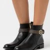 MICHAEL Michael Kors ABIGAIL FLAT - Ankle Boots - Black/brown -MICHAEL Michael Kors shop dc308c719eac4703970bceabe79401e1