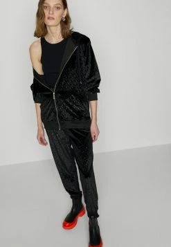 MICHAEL Michael Kors LOGO SLOUCHY - Tracksuit Bottoms - Black -MICHAEL Michael Kors shop de9118b3fb6147bd8c740fdaabf955ea