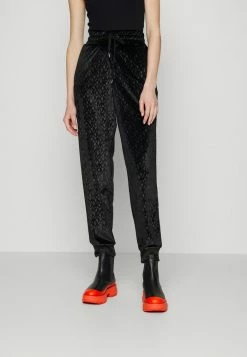 MICHAEL Michael Kors LOGO SLOUCHY - Tracksuit Bottoms - Black -MICHAEL Michael Kors shop fa3e58aed8ab4bd2a3cf080b26cf55c9